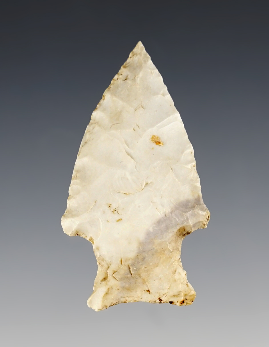 2 3/8" Archaic Stemmed point made from Burlington Chert with a needle tip. Found in Missouri.