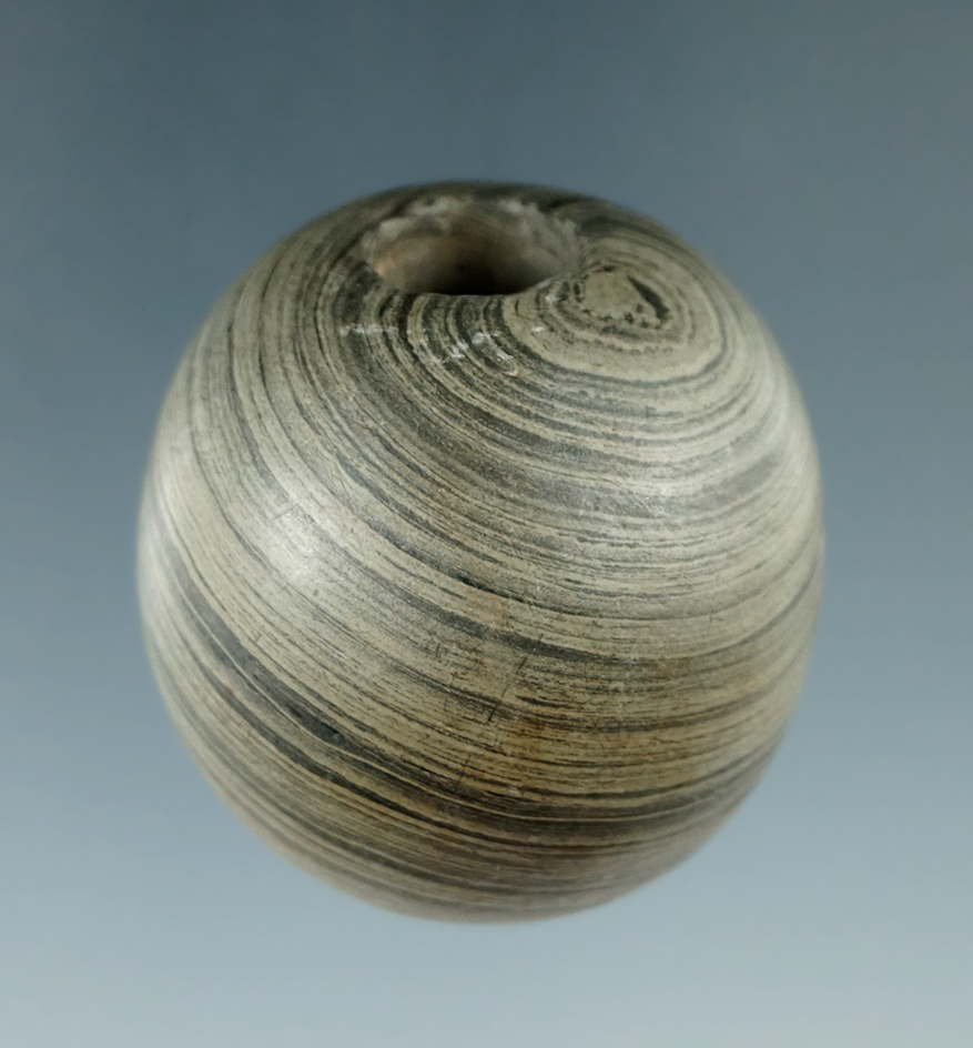 1 1/2" Archaic Ball Bannerstone made from green and black Banded Slate, found in Butler Co., Ohio.