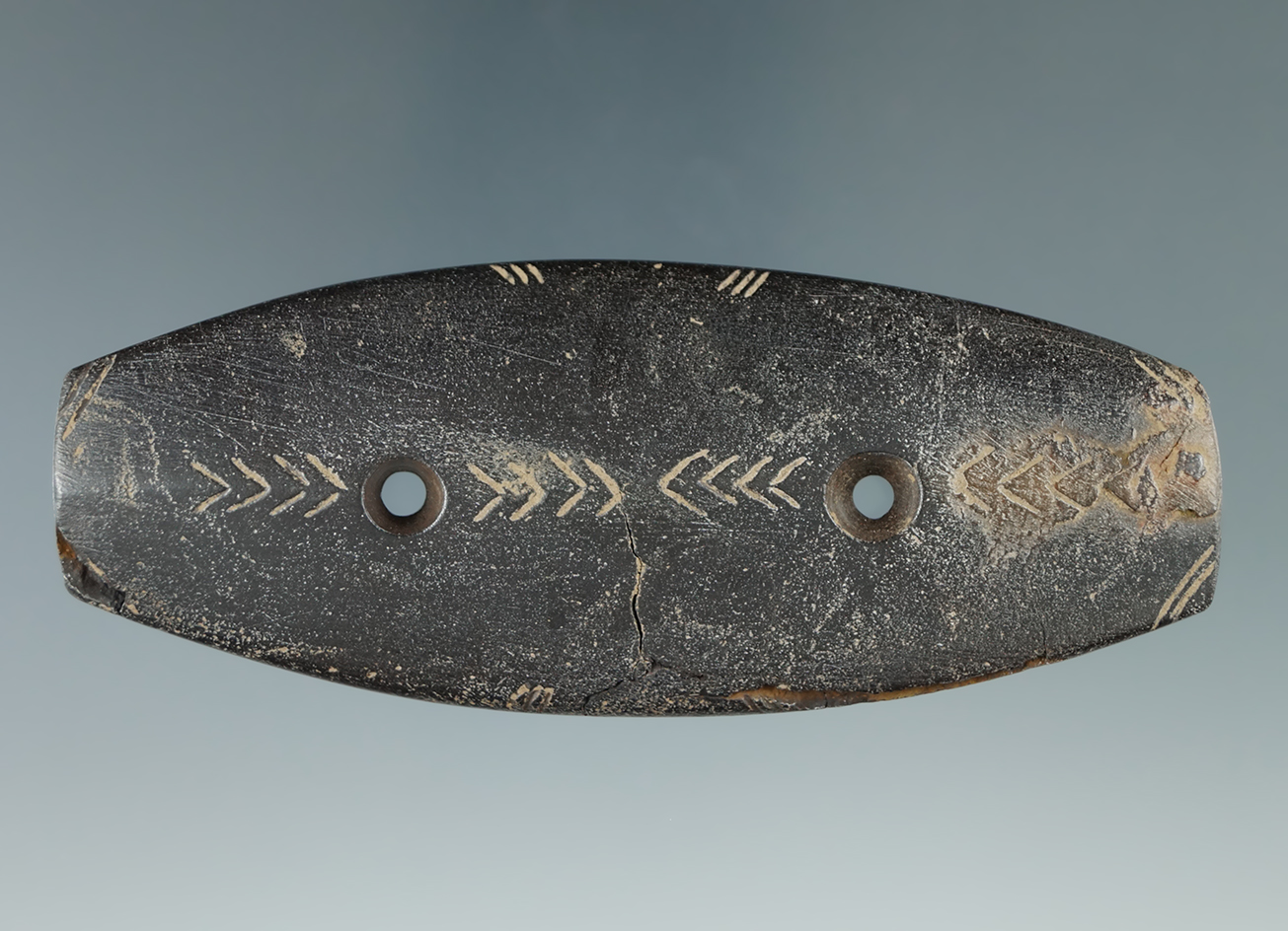 3 13/16" Hopewell Expanded Center Gorget that is nicely engravedfound along the Ohio River. Pictured