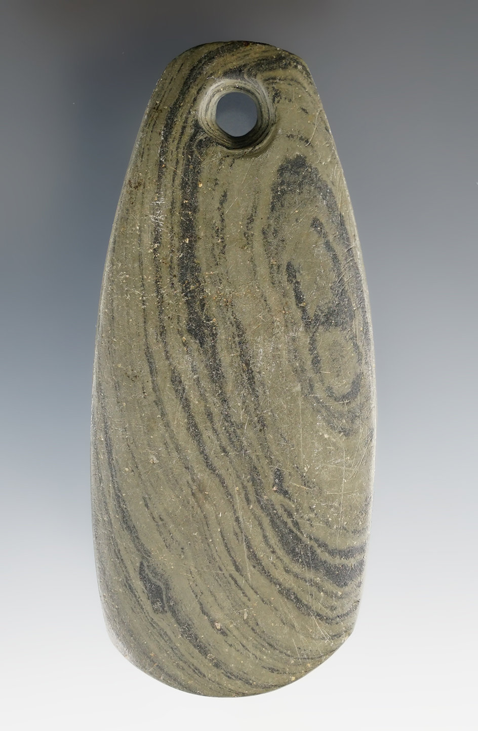 3 5/16" Adena Ovate Pendant made from green and black Banded Slate. Adams Co., Ohio.