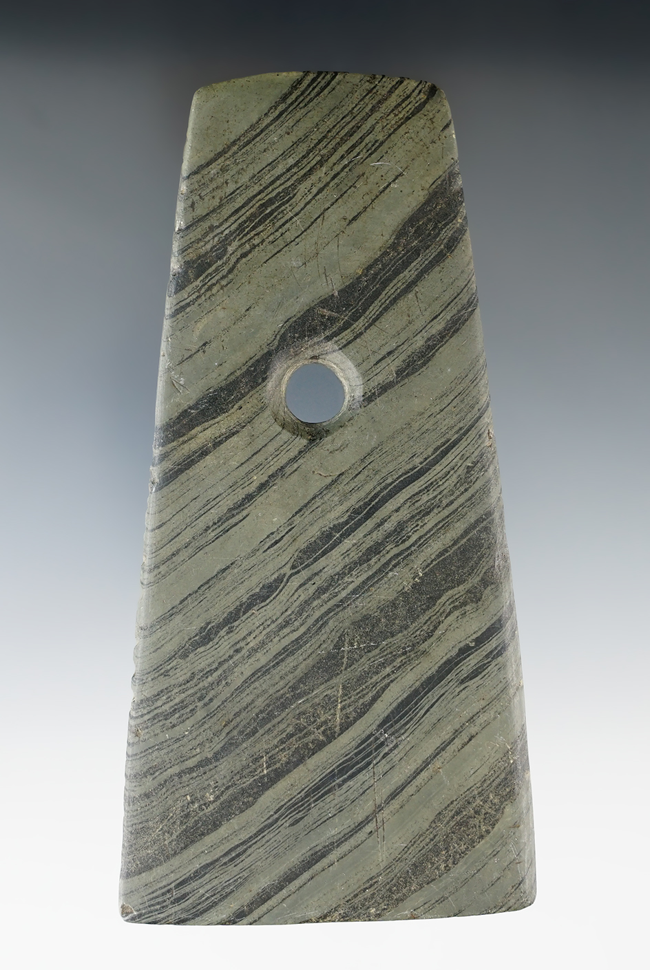 4 3/4" Adena Trapezoidal that is tallied on one edge found in Lucas Co., Ohio. Who's Who #10.