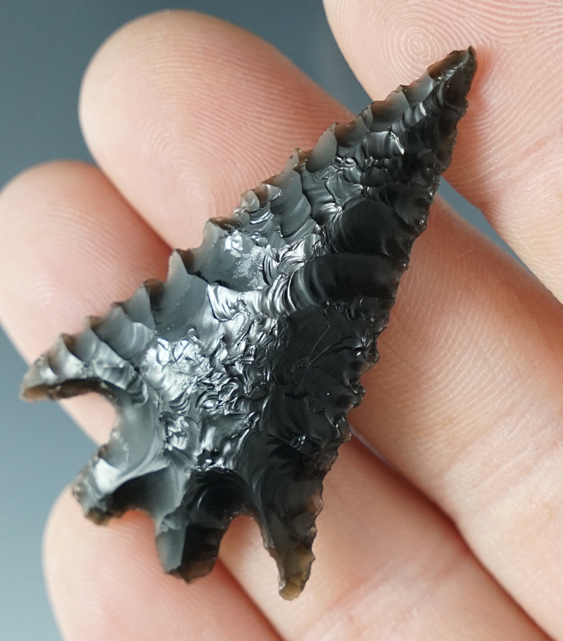 Nice style on this 2" Pinto Basin made from black Obsidian. Found in the Great Basin, Oregon.