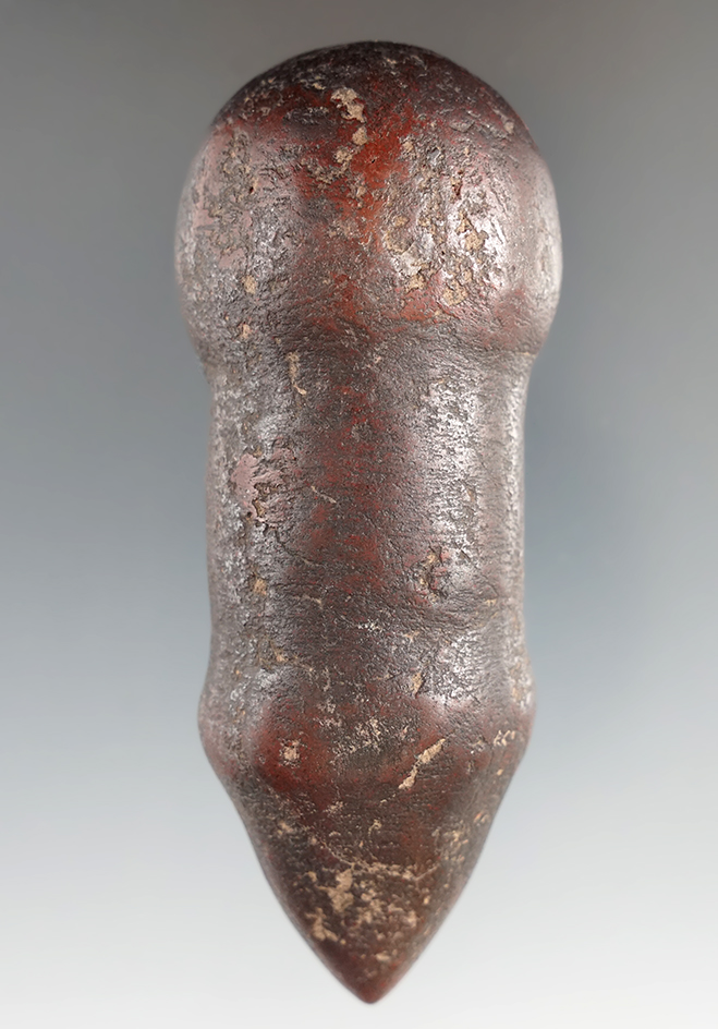 Uniquely shaped 3 13/16" hematite clubhead found in the Plains region.